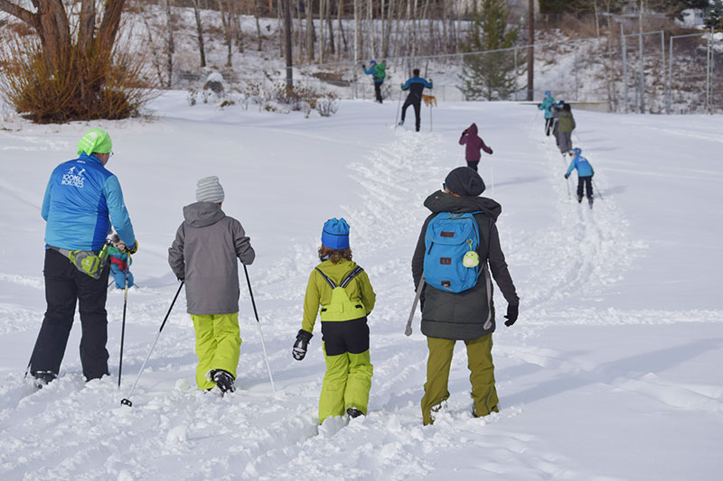 young skiers head out for a skills development program lesson